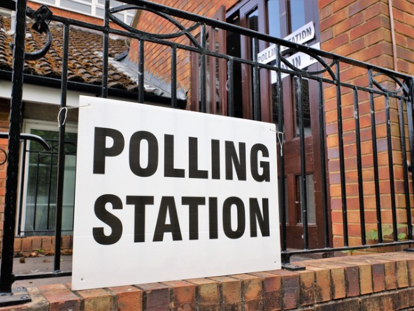 polling station sign on a railing